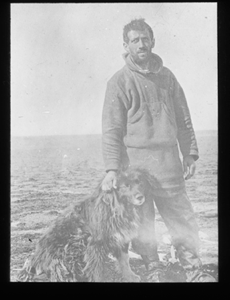 Image of H. "Clam" Williams, able seaman, with dog 